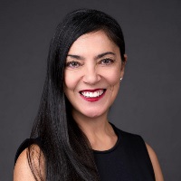Smiling person with shoulder length brown hair 