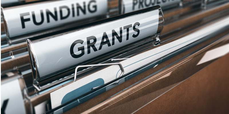 File folder labeled with the word grants