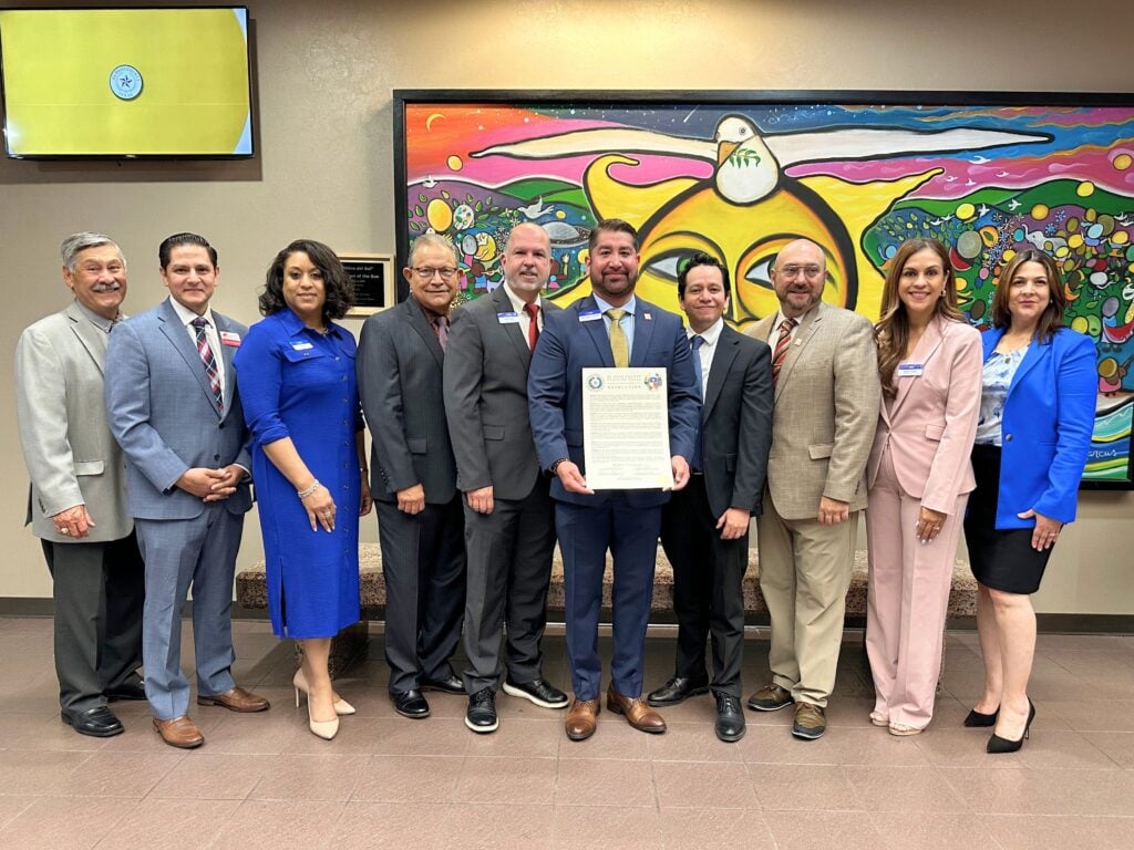 Raiz Federal Credit Union receives a proclamation from the El Paso County Judge and Commissioners Court commemorating the credit union's 90th anniversary.